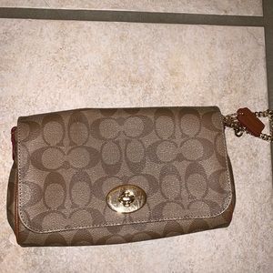 Coach wristlet or crossbody(comes with strap)